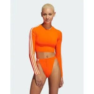 Adidas IVY PARK neon orange cropped rash guard top.